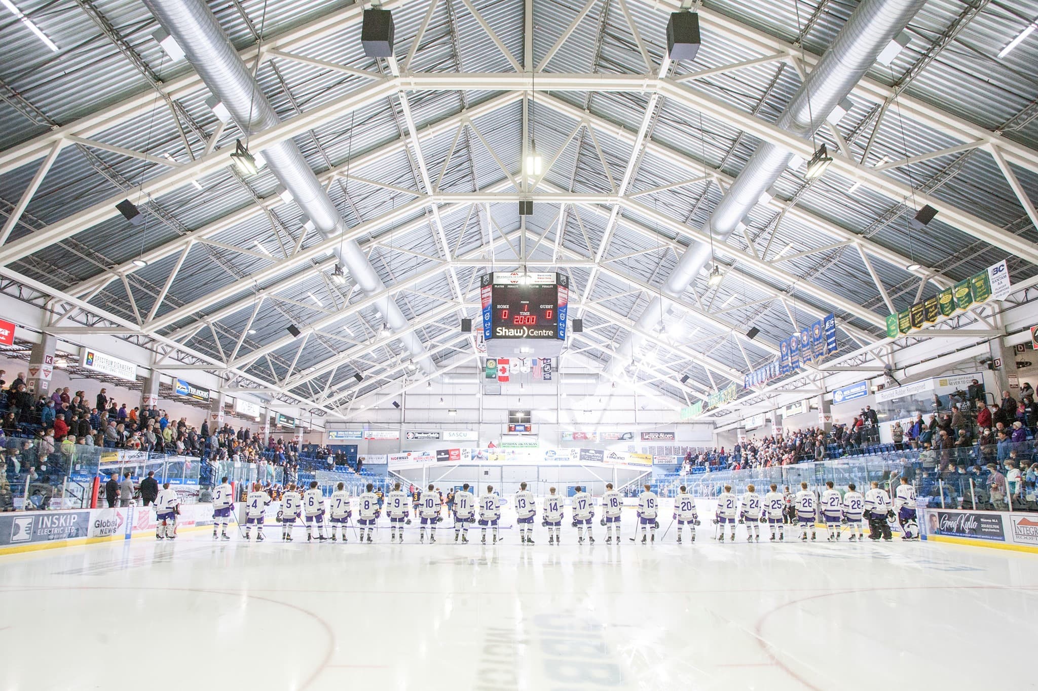 Players lined up on the ice inside the Shaw Centre in Salmon Arm